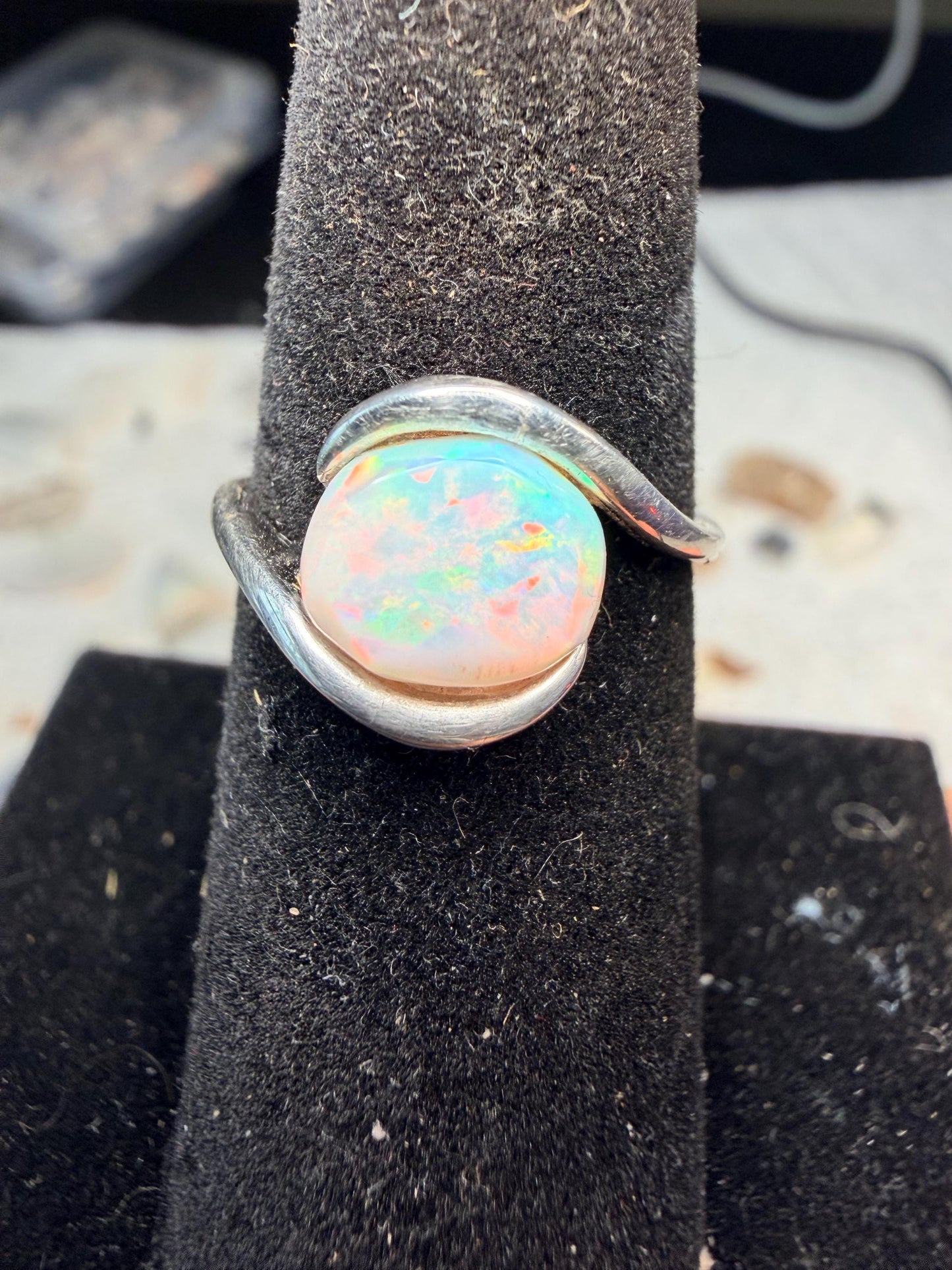 Small but flashy 1.5 carat Ethiopian opal adjustable ring