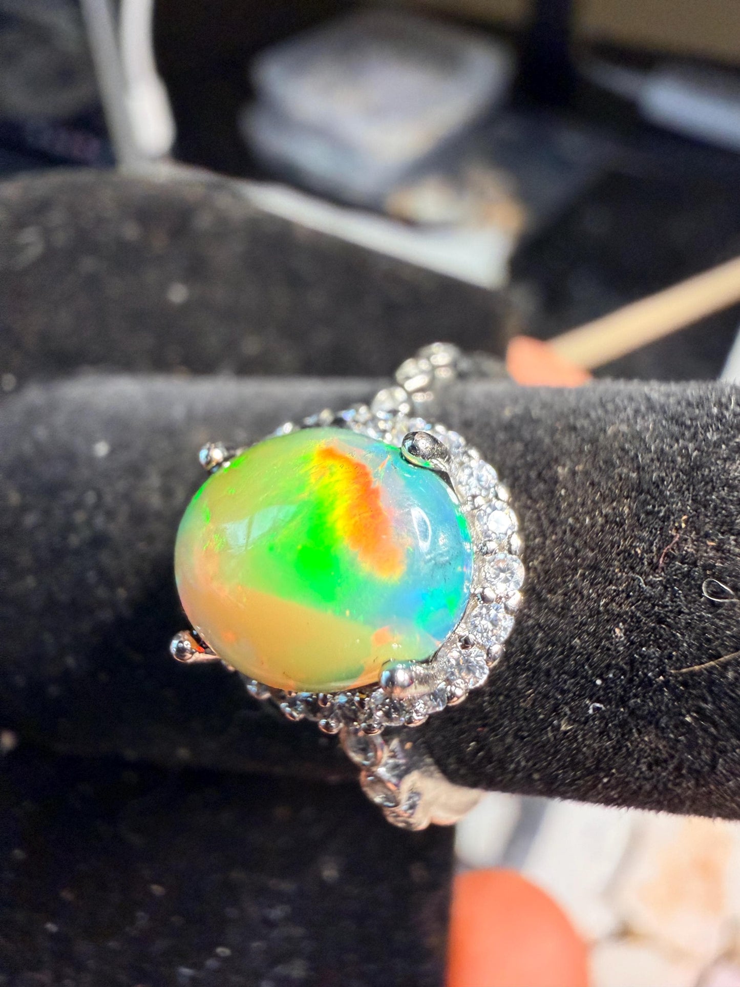 2.2 carat Ethiopian opal adjustable ring green base green orange flash