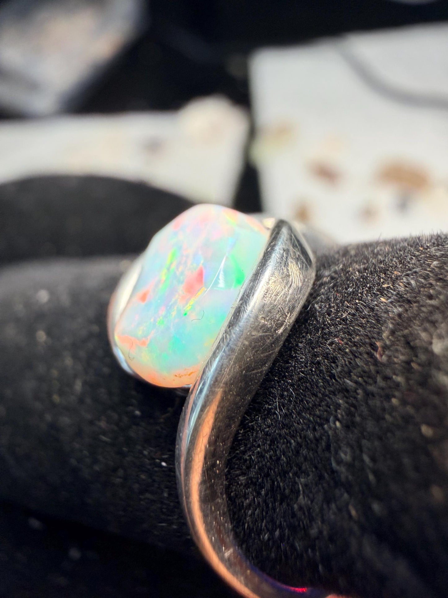 Small but flashy 1.5 carat Ethiopian opal adjustable ring