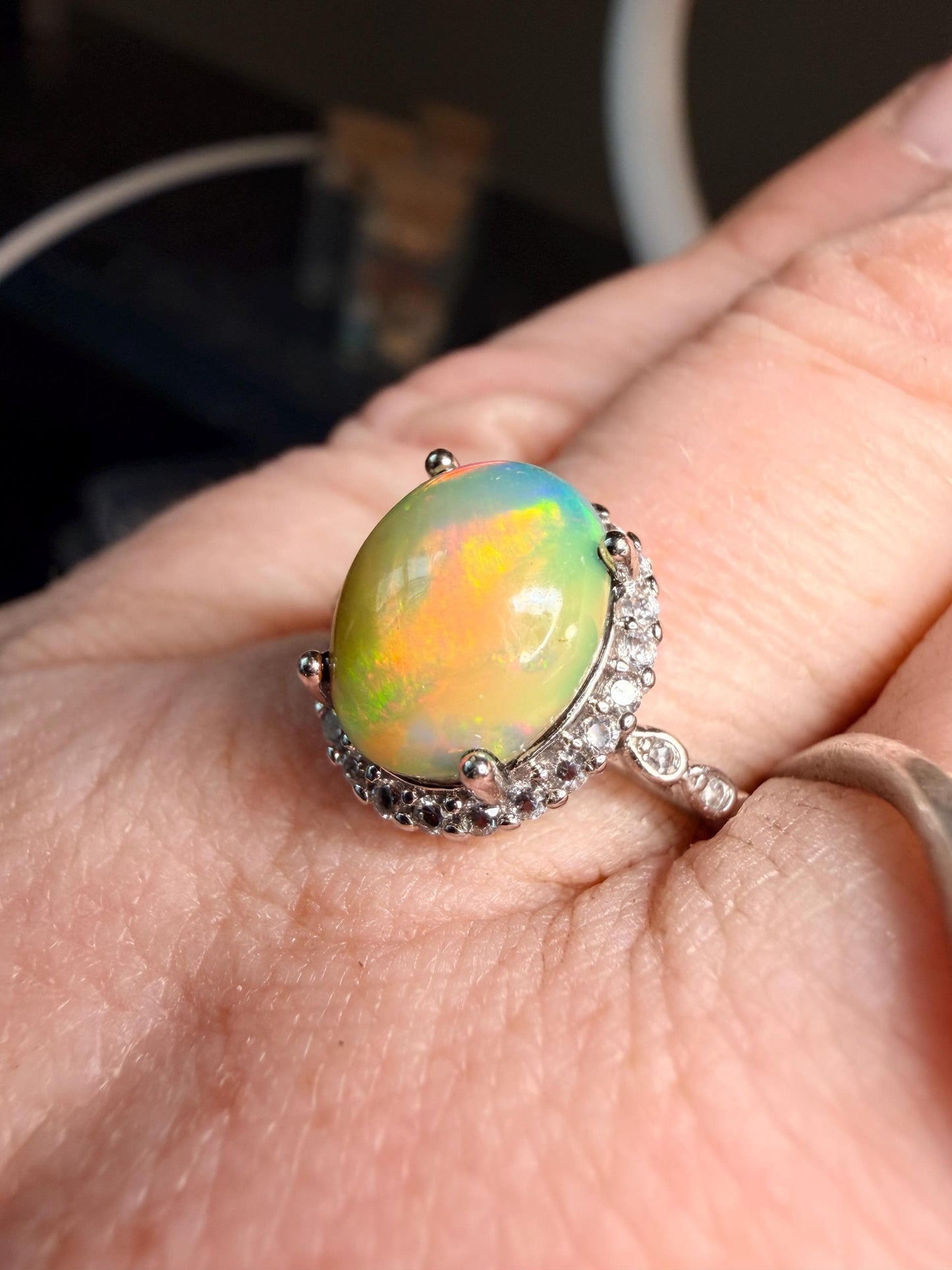 2.2 carat Ethiopian opal adjustable ring green base green orange flash