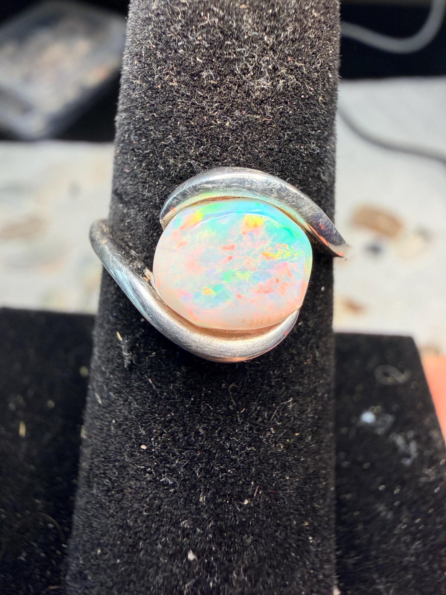 Small but flashy 1.5 carat Ethiopian opal adjustable ring