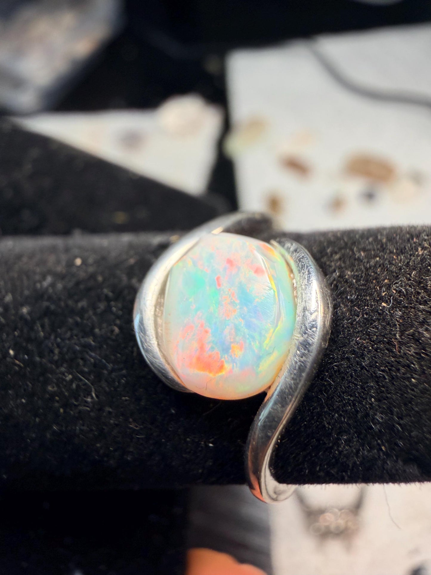 Small but flashy 1.5 carat Ethiopian opal adjustable ring