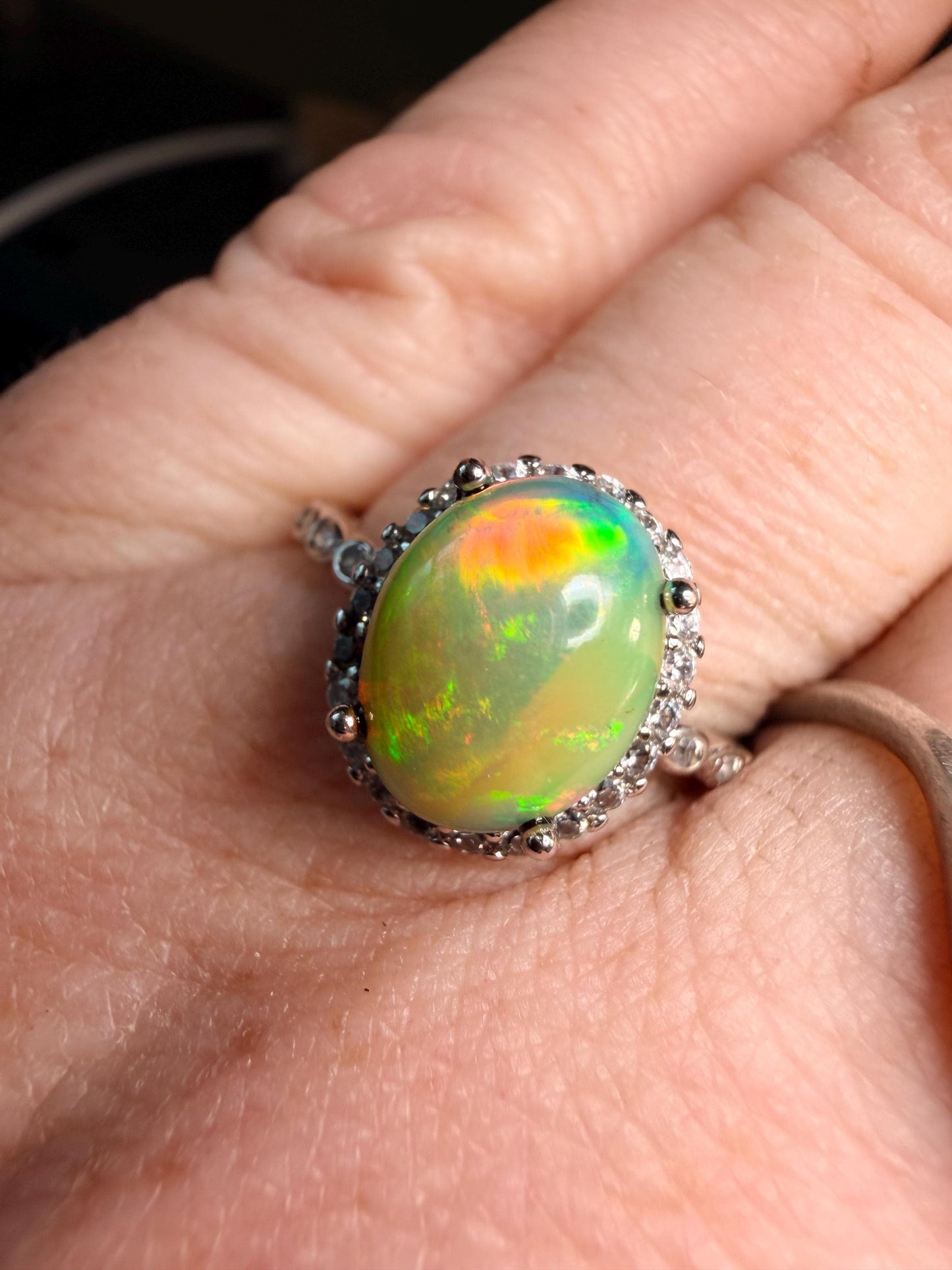 2.2 carat Ethiopian opal adjustable ring green base green orange flash