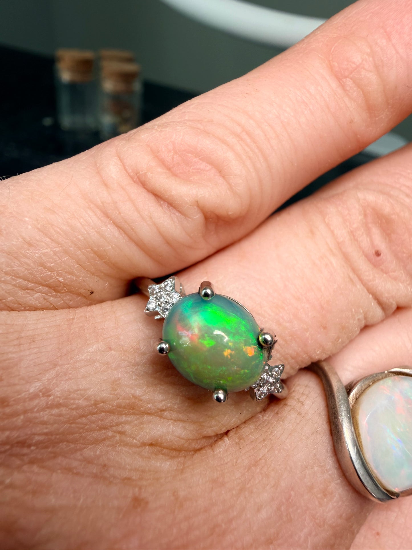 Ethiopian opal adjustable ring with green and orange flash