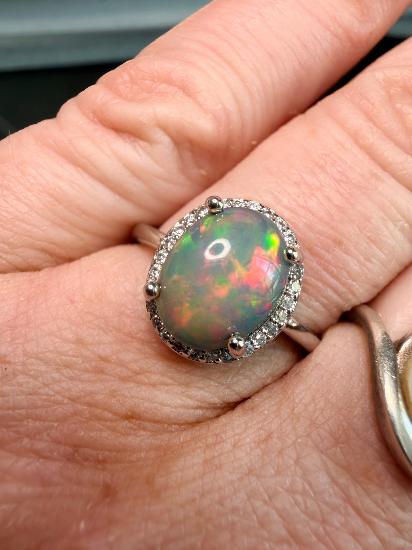 2.2 carat Ethiopian opal adjustable ring dark base