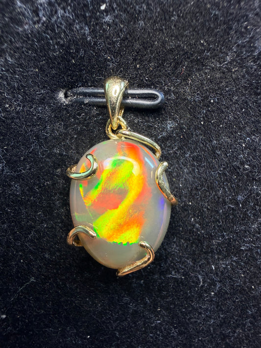 5.9 carat all natural Ethiopian opal pendant in 925 gold setting