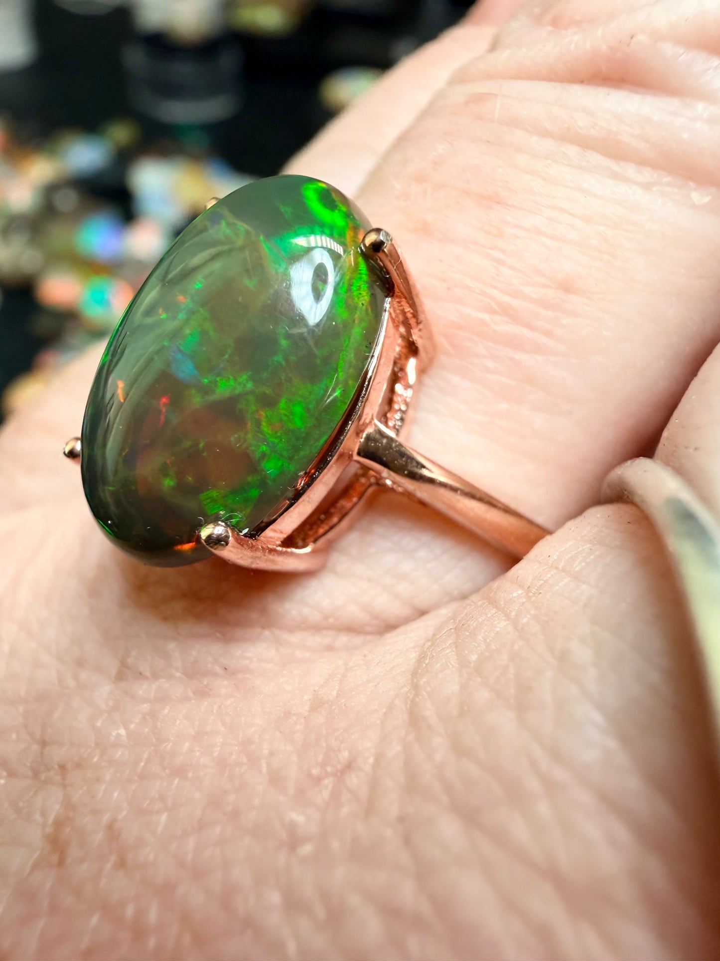 3.5 carat Ethiopian opal adjustable ring in rose gold 925 setting.  Green/orange flash