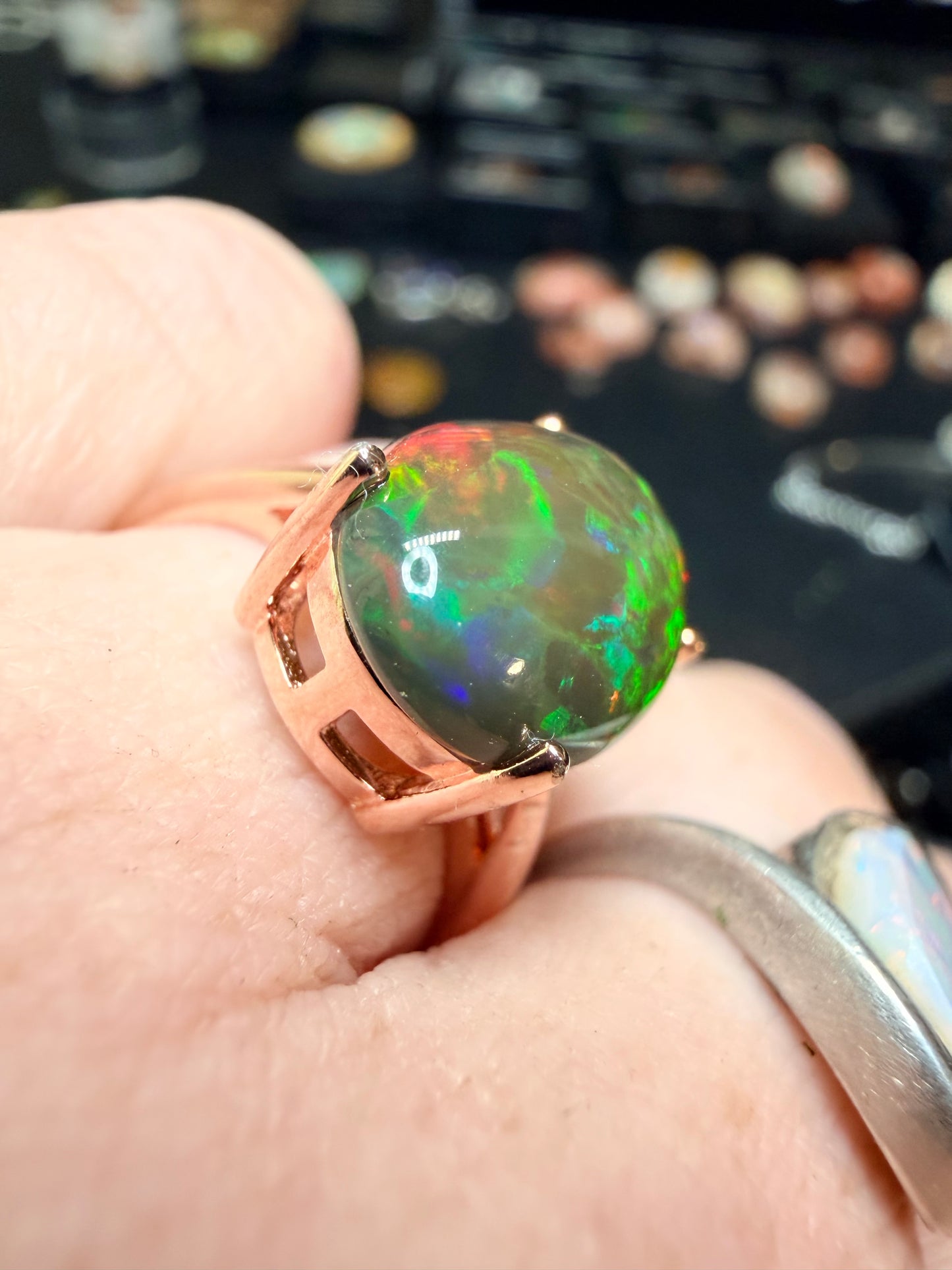 3.5 carat Ethiopian opal adjustable ring in rose gold 925 setting.  Green/orange flash