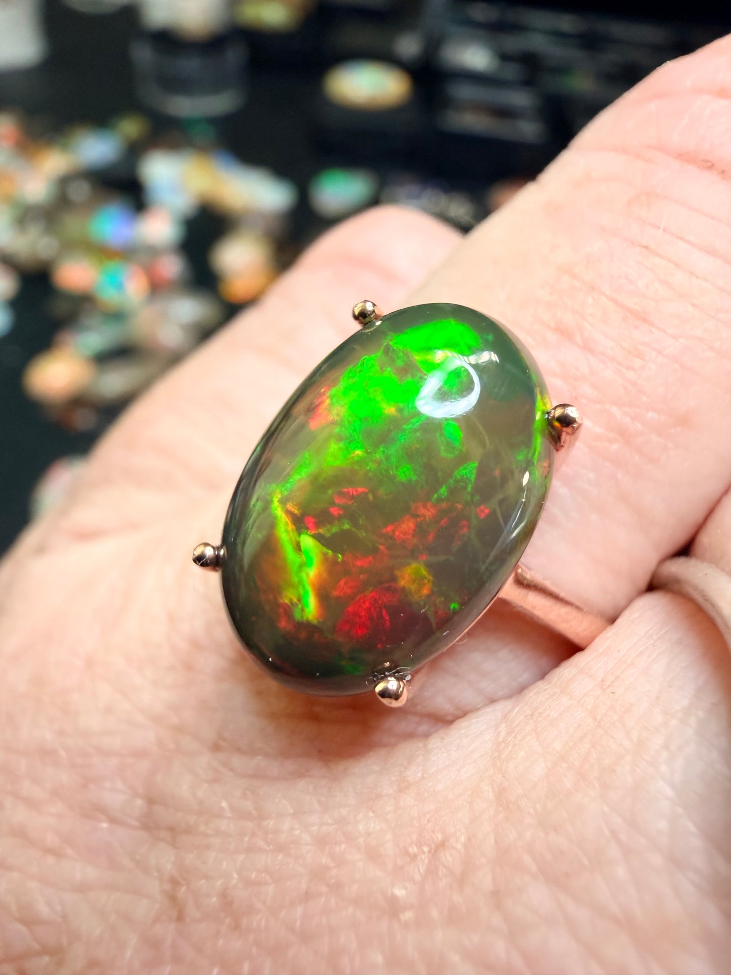 3.5 carat Ethiopian opal adjustable ring in rose gold 925 setting.  Green/orange flash