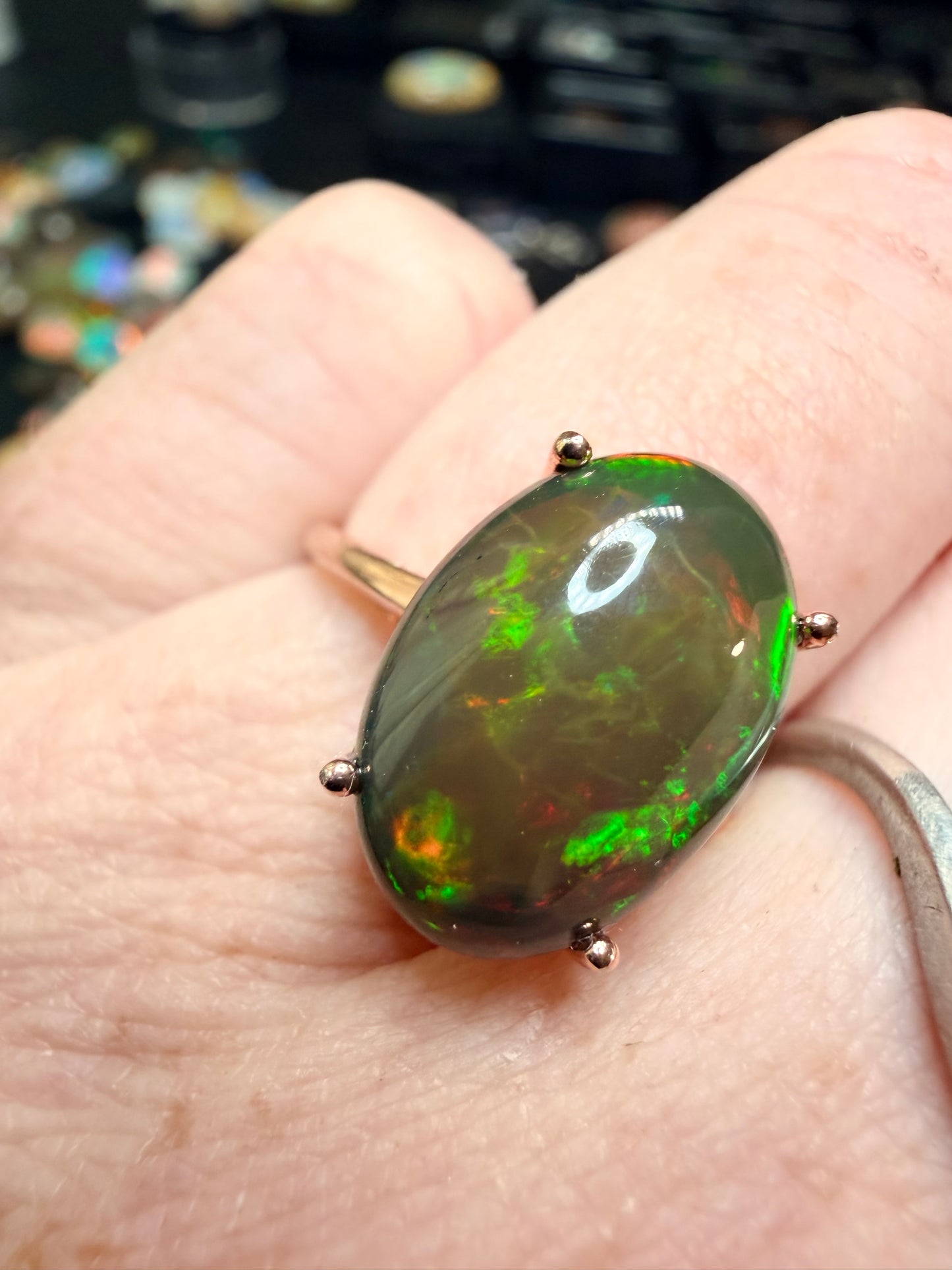 3.5 carat Ethiopian opal adjustable ring in rose gold 925 setting.  Green/orange flash
