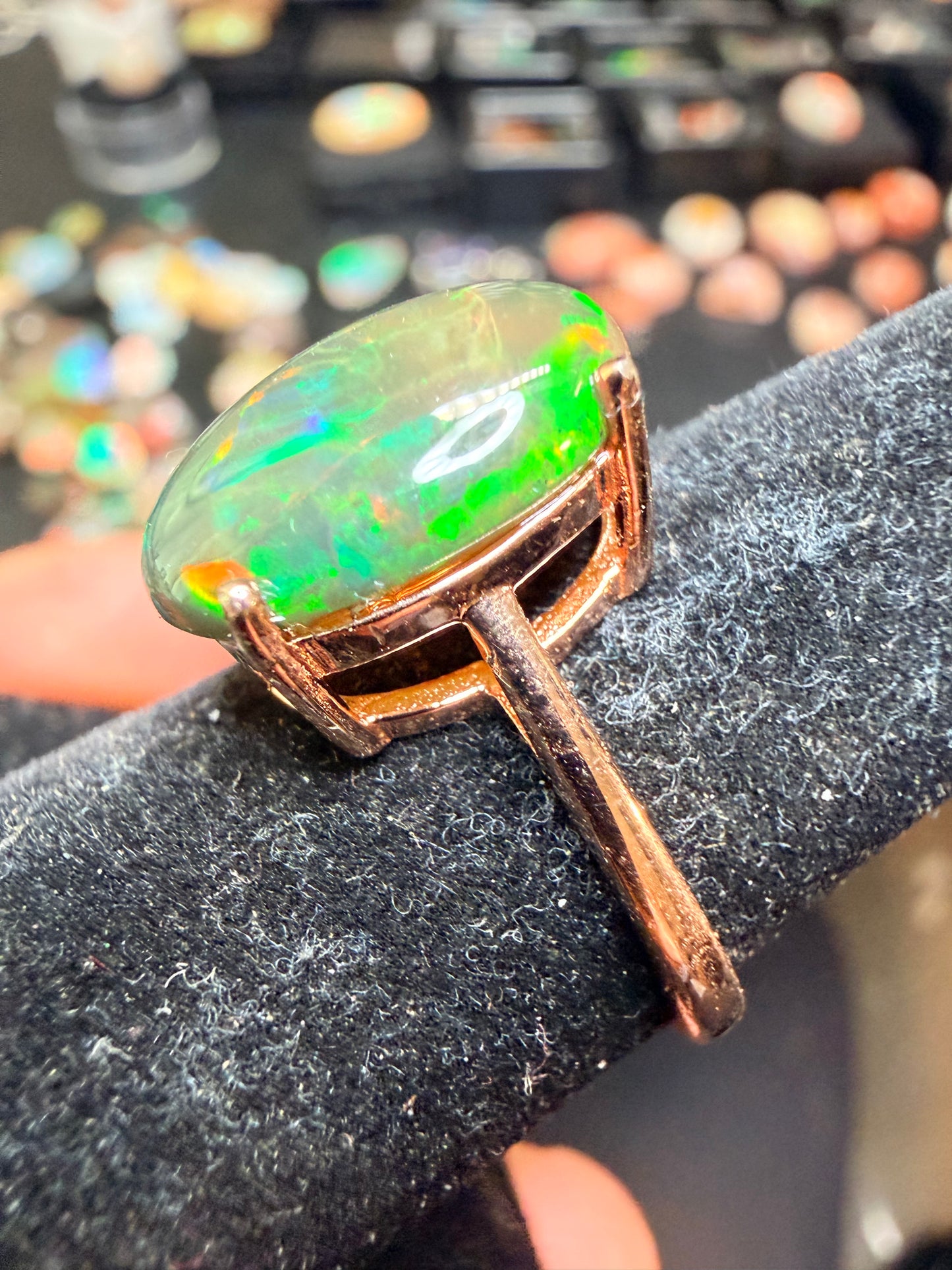 3.5 carat Ethiopian opal adjustable ring in rose gold 925 setting.  Green/orange flash