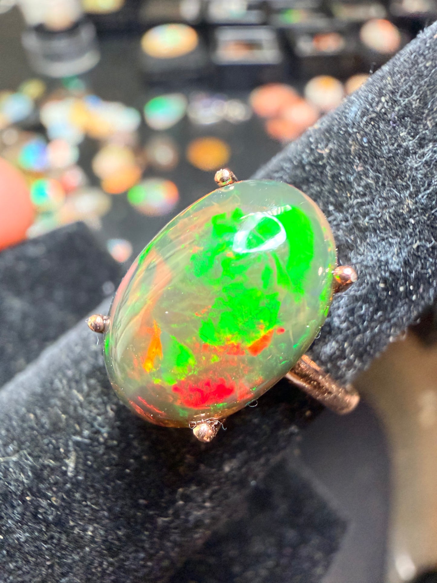 3.5 carat Ethiopian opal adjustable ring in rose gold 925 setting.  Green/orange flash