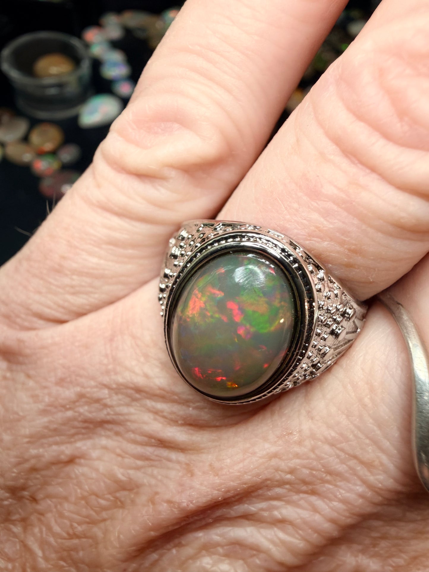Men’s all natural 3.7 carat Ethiopian opal adjustable ring in dark base