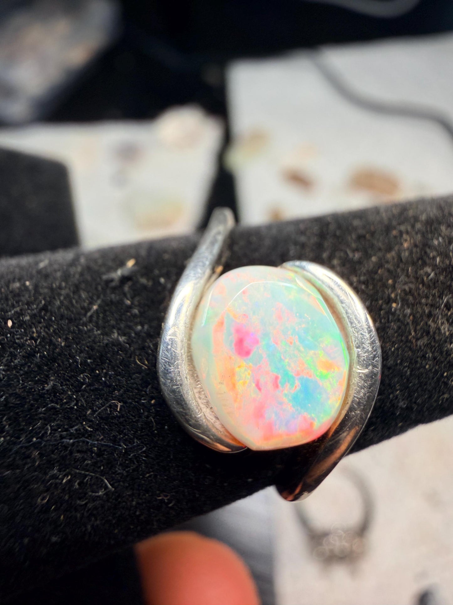 Small but flashy 1.5 carat Ethiopian opal adjustable ring